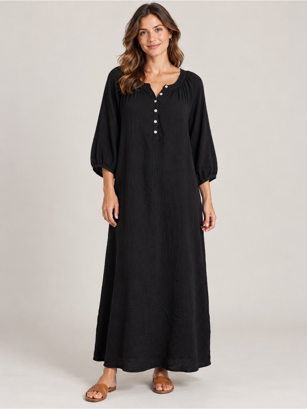 a Wonderly black crinkle cotton gauze henley midi dress